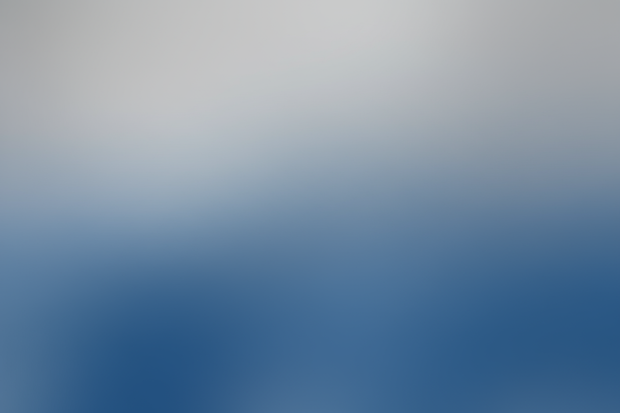 Gradient background transitioning from light gray to blue